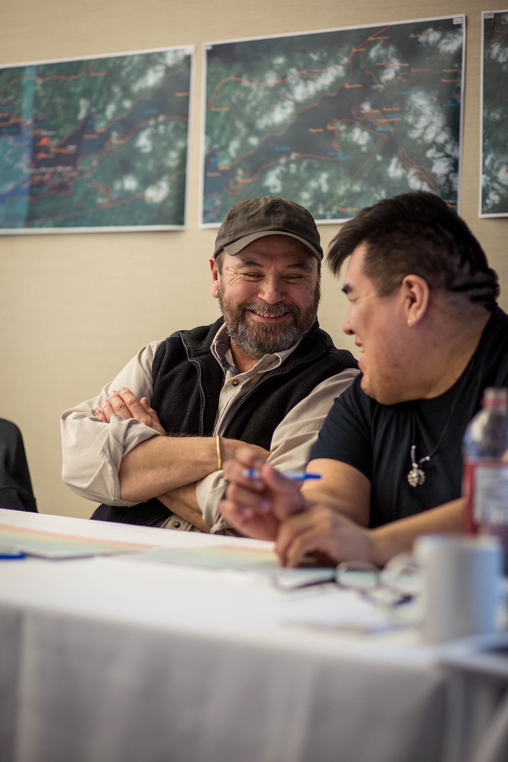 Two participants in conversation during a Tlowitsis planning session