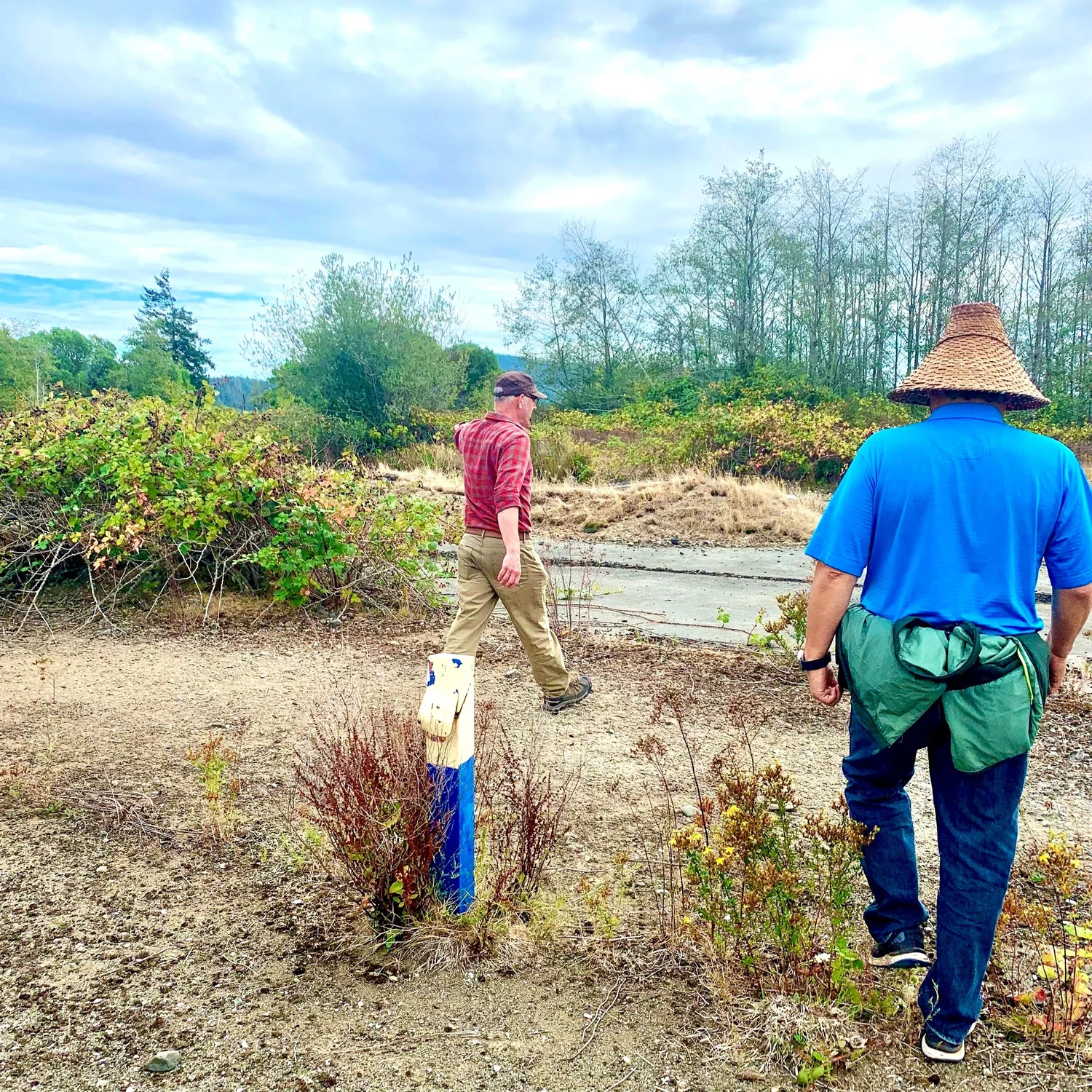Two people walking through a prospective Treaty lands site on Vancouver Island